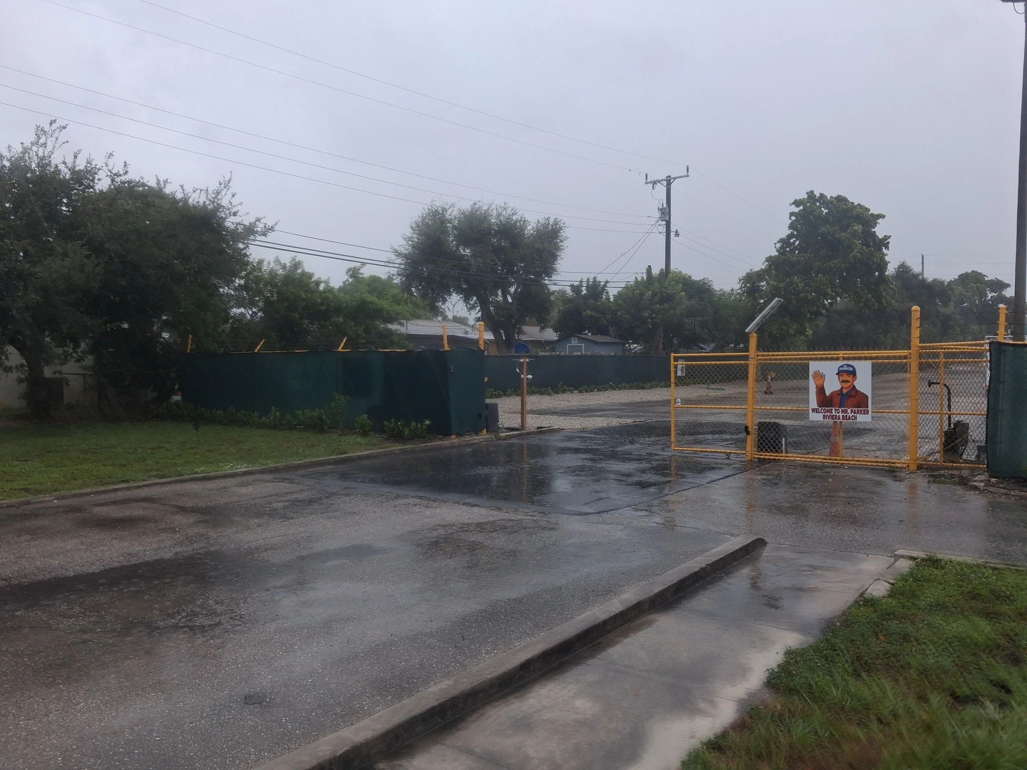Yellow entrance gate at Mr. Parker Riviera Beach