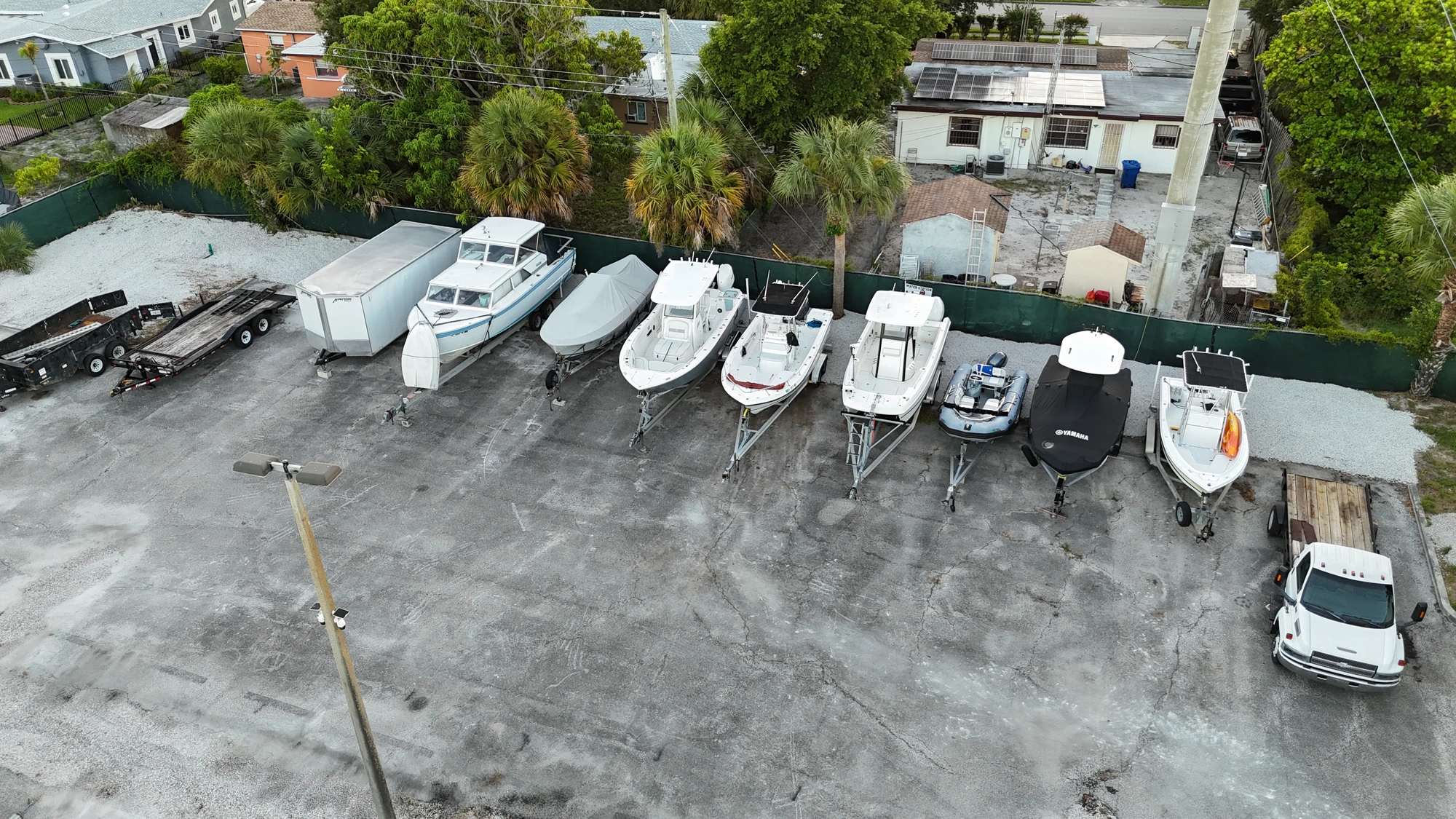 Boats lined along the fence at Avenue E