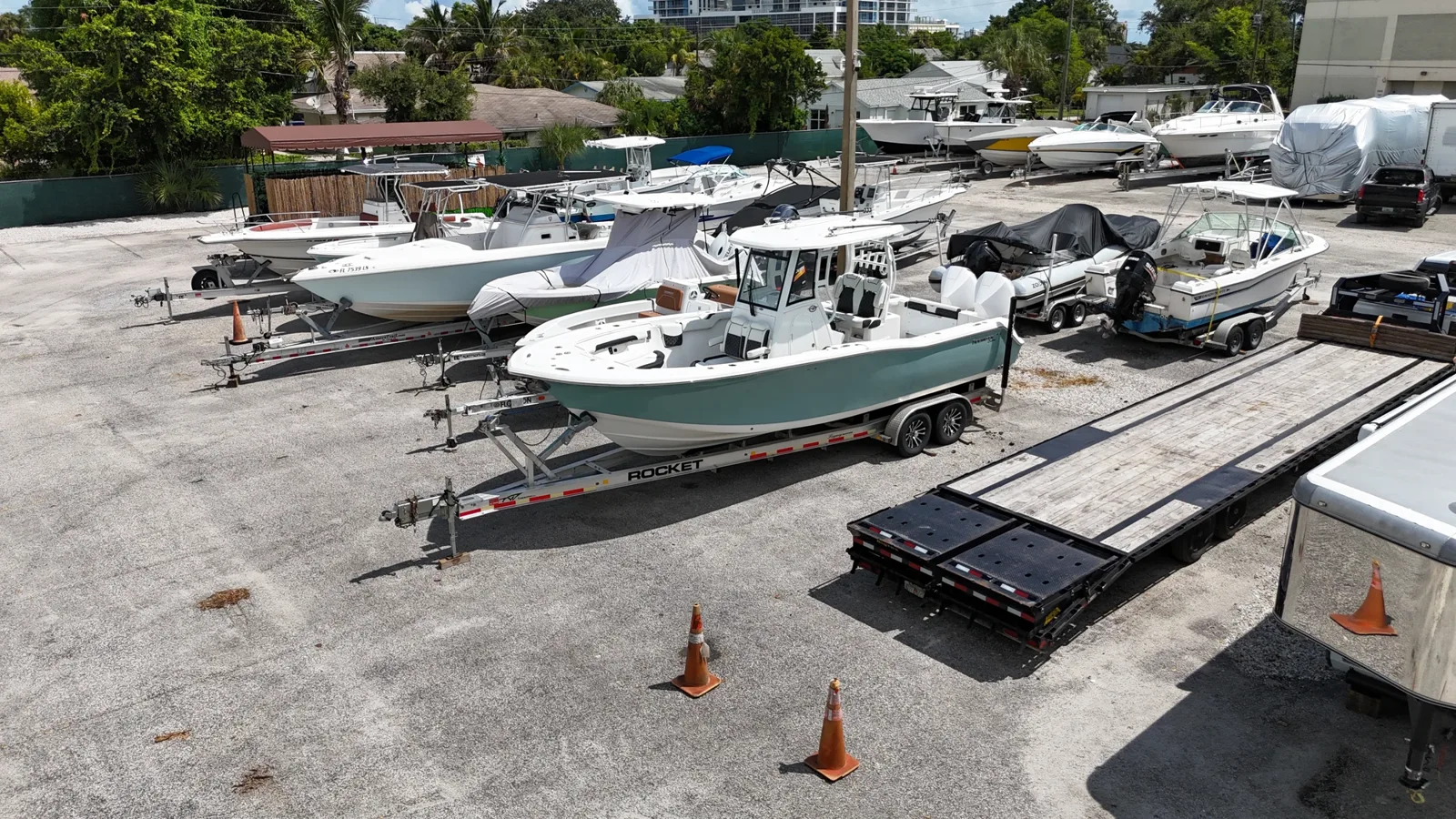 Center-console boats on trailers in the Riviera Beach yard