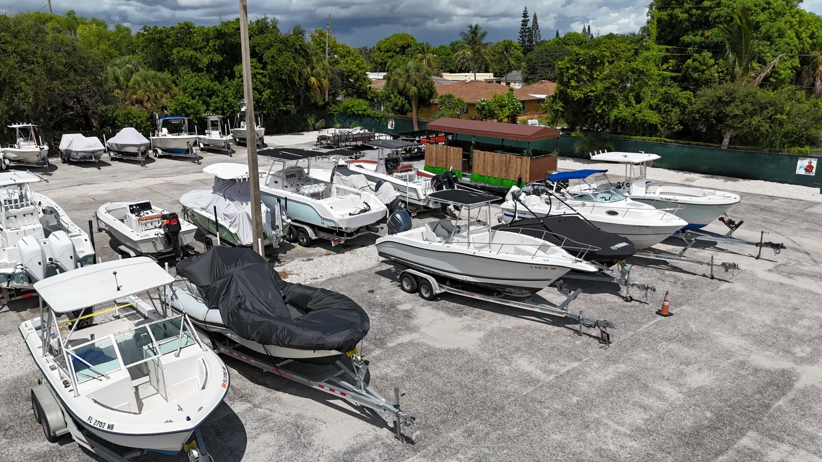 Rows of boats and covered vessels at the Avenue E lot