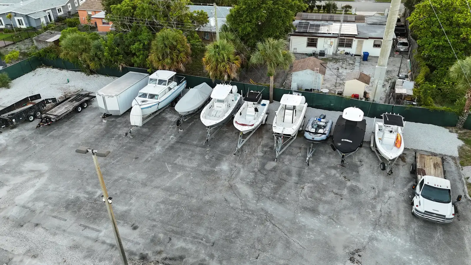 Boats lined along the fence at Avenue E